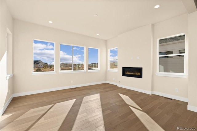 unfurnished living room with light hardwood / wood-style flooring