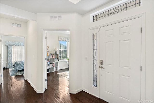 entrance foyer with dark hardwood / wood-style floors