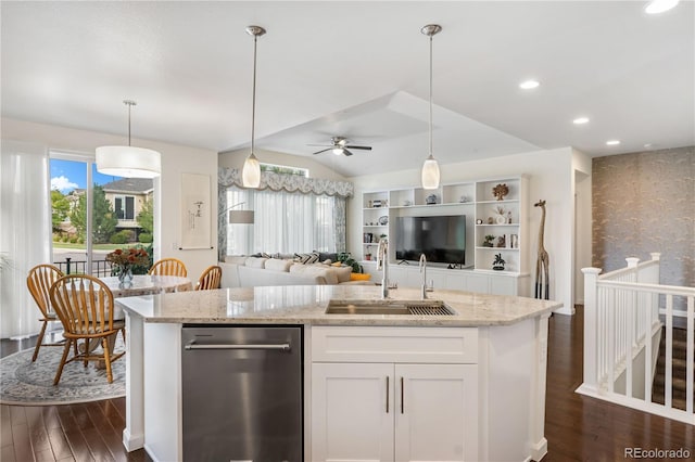 kitchen featuring light stone countertops, sink, white cabinets, and ceiling fan