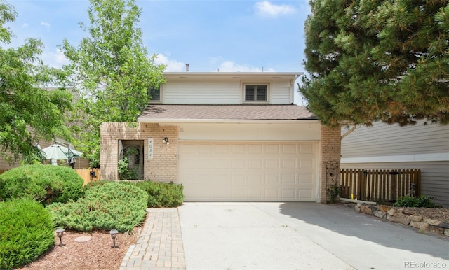 4034 S Atchison Way, Aurora, CO 80014 - view of front facade with brick siding and concrete driveway