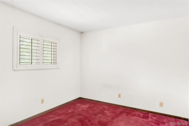 4034 S Atchison Way, Aurora, CO 80014 - spare room featuring dark colored carpet and baseboards
