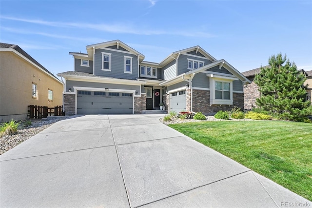 craftsman-style home featuring a garage and a front yard