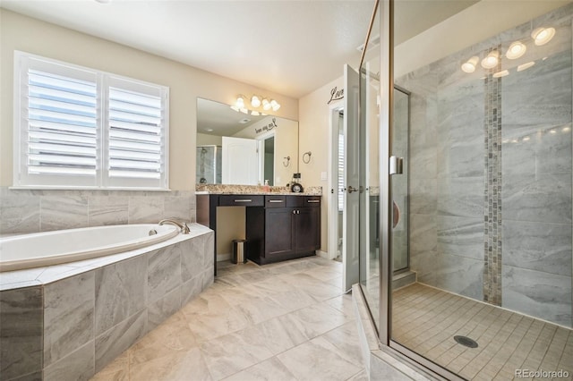 bathroom featuring vanity and separate shower and tub