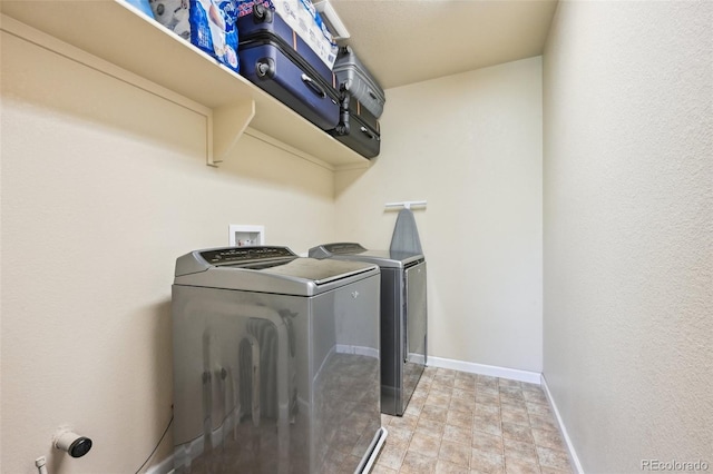 clothes washing area with independent washer and dryer