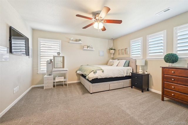 carpeted bedroom featuring ceiling fan