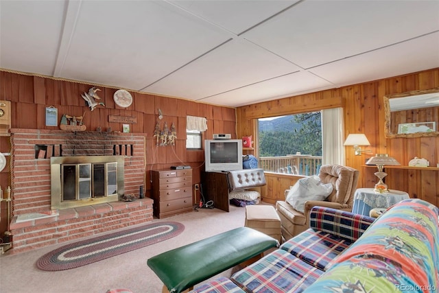 307 Virginia Rd, Bailey, CO 80421 - carpeted living area with wood walls and a brick fireplace