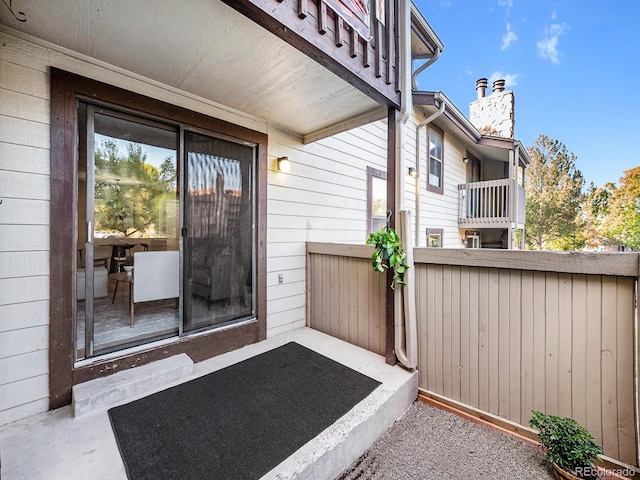 entrance to property with a balcony