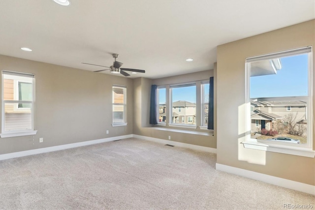 carpeted empty room with ceiling fan