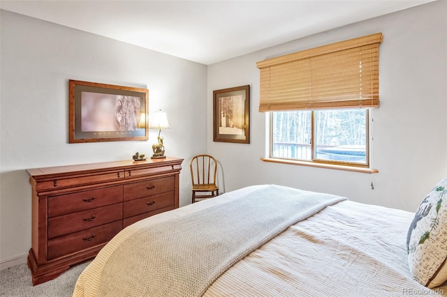 bedroom featuring light colored carpet