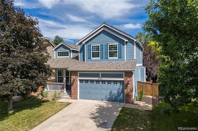 8982 Miners Pl, Highlands Ranch, CO 80126 - view of front of property with driveway, a garage, brick siding, and roof with shingles