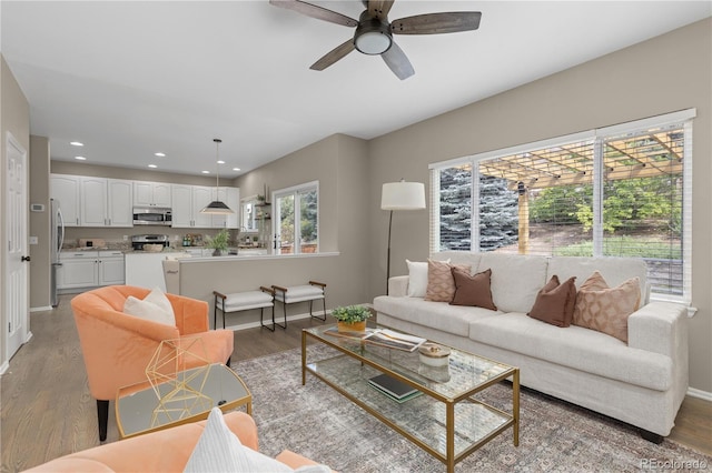 8982 Miners Pl, Highlands Ranch, CO 80126 - living room with ceiling fan, light wood-style floors, and recessed lighting