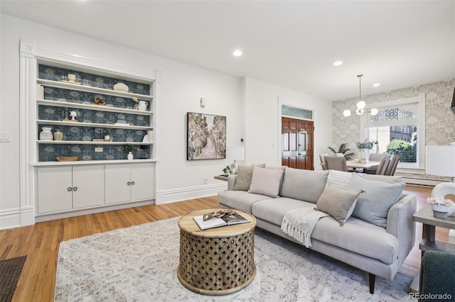 1215 N Emerson St Unit A, Denver, CO 80218 - living room with a chandelier, light wood-style floors, recessed lighting, and baseboard heating