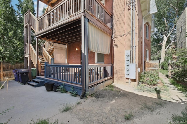 1215 N Emerson St Unit A, Denver, CO 80218 - view of home's exterior with brick siding and stairway
