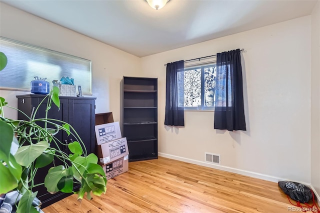 miscellaneous room with hardwood / wood-style floors