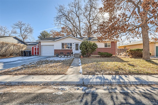 ranch-style home with a garage and a front yard