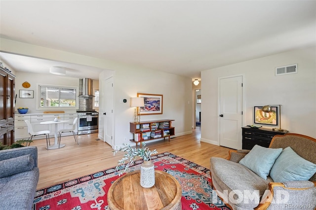 2965 S Gilpin St, Denver, CO 80210 - living room with light wood-style flooring and baseboards