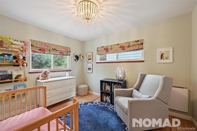 2965 S Gilpin St, Denver, CO 80210 - bedroom featuring wood finished floors and a chandelier