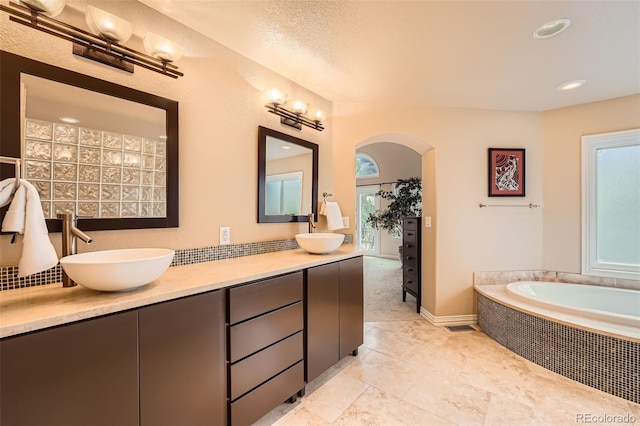 19770 E Geddes Pl, Centennial, CO 80016 - bathroom featuring double vanity, a bath, recessed lighting, tile patterned flooring, and decorative backsplash