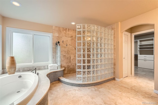 19770 E Geddes Pl, Centennial, CO 80016 - full bathroom with a walk in shower, a garden tub, a spacious closet, and recessed lighting