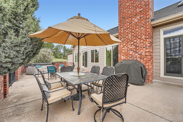 19770 E Geddes Pl, Centennial, CO 80016 - view of patio / terrace featuring grilling area, a hot tub, and outdoor dining space