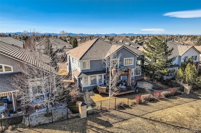 view of front of house featuring a fenced backyard and a residential view