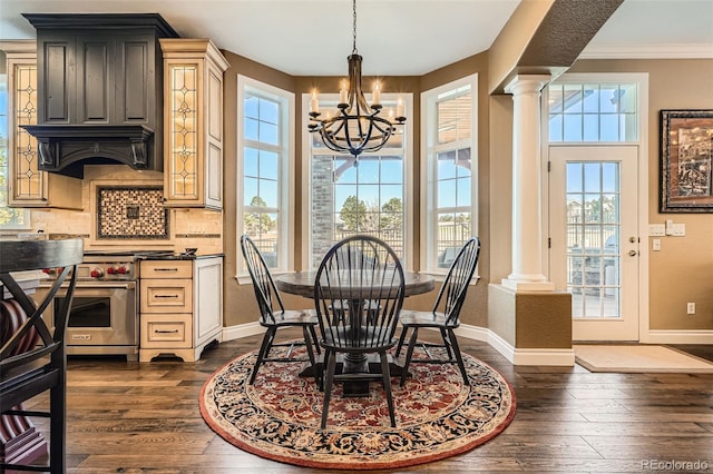 dining room with baseboards, dark wood-style flooring, and ornate columns