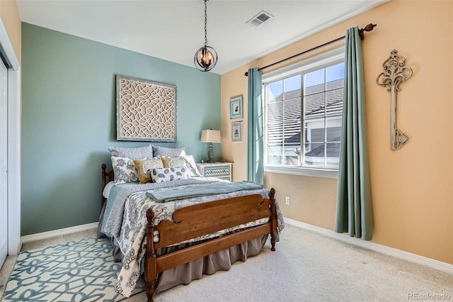 bedroom with baseboards, visible vents, and carpet floors