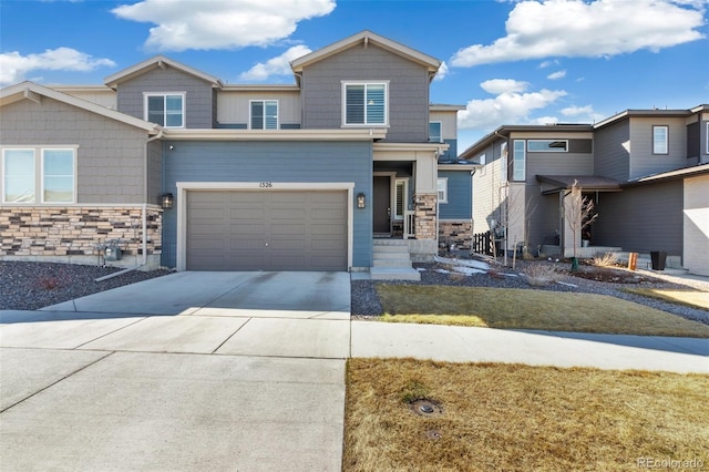 view of front of property featuring stone siding and concrete driveway