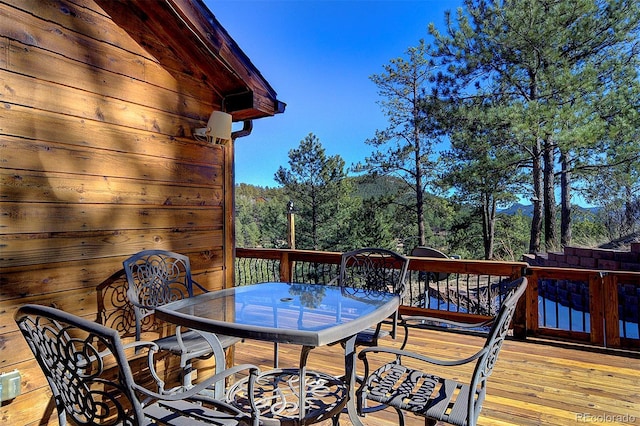 wooden deck with outdoor dining space