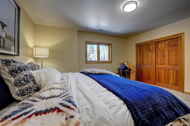 carpeted bedroom with visible vents