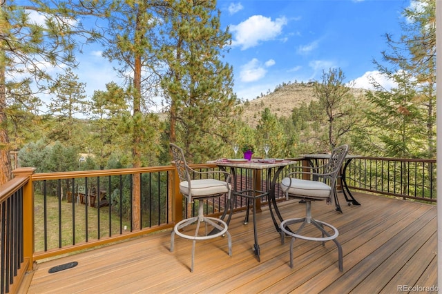 deck with outdoor dining space