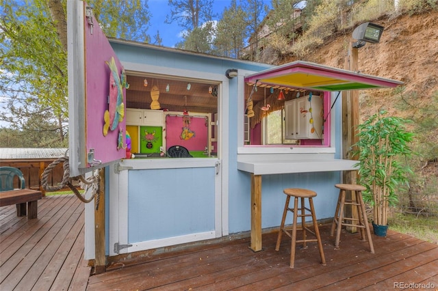 wooden terrace with outdoor dry bar