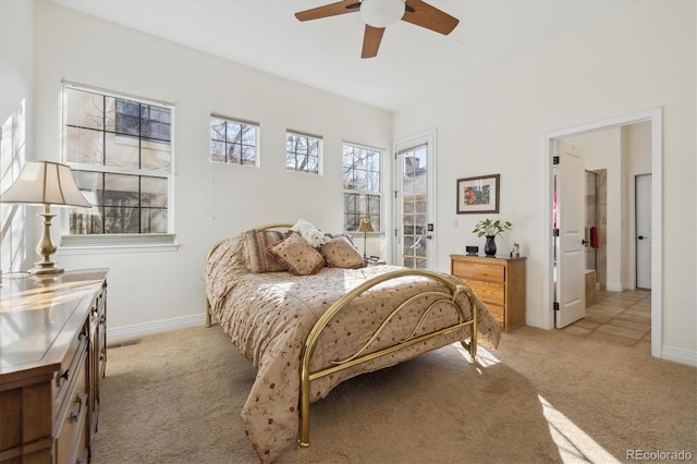 bedroom featuring light carpet, ceiling fan, and baseboards