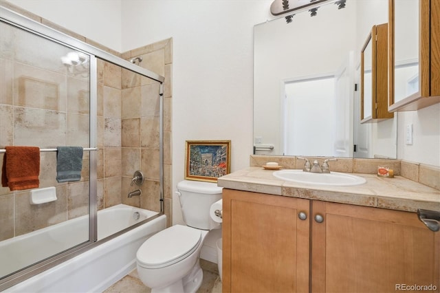 bathroom with bath / shower combo with glass door, toilet, and vanity