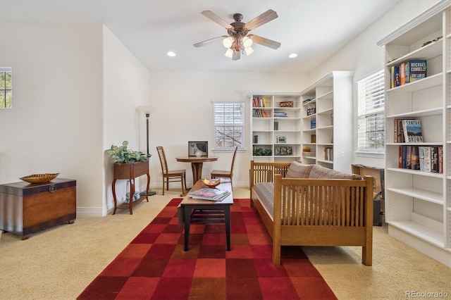 living area featuring recessed lighting, baseboards, carpet, and ceiling fan