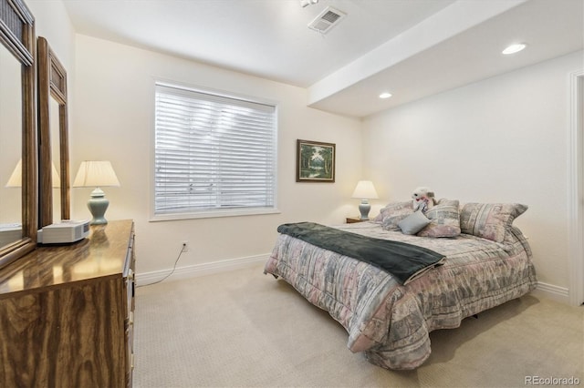 bedroom featuring light carpet, visible vents, and baseboards