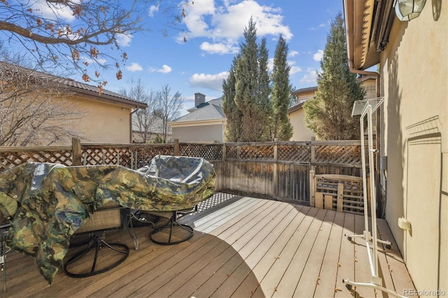 wooden deck featuring outdoor dining area