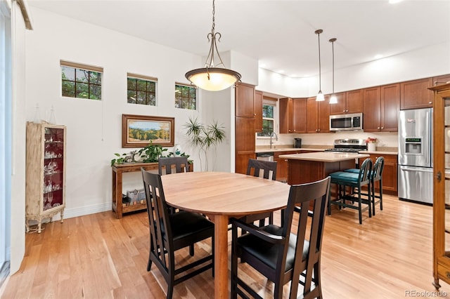 7444 E 9th Ave, Denver, CO 80230 - dining space with light wood-style floors, recessed lighting, and baseboards