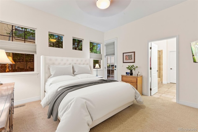 7444 E 9th Ave, Denver, CO 80230 - bedroom featuring light carpet, baseboards, ensuite bath, and ceiling fan