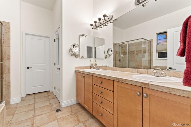 7444 E 9th Ave, Denver, CO 80230 - bathroom with a shower stall, double vanity, and baseboards