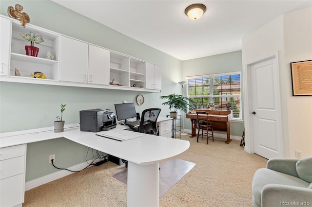 7444 E 9th Ave, Denver, CO 80230 - home office featuring light carpet, built in study area, and baseboards