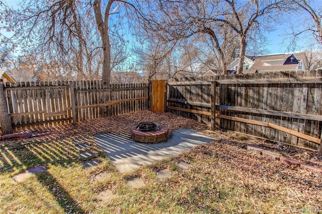 view of yard with an outdoor fire pit