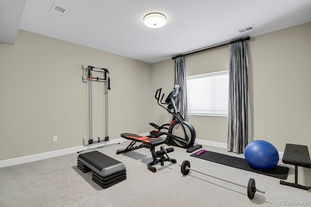 exercise area with carpet, baseboards, and visible vents