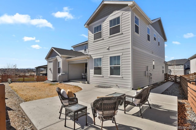 back of house with a patio area and a fenced backyard