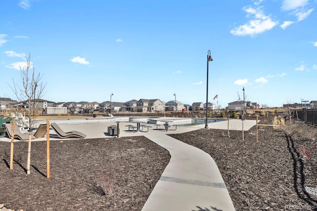 view of home's community featuring a residential view and playground community