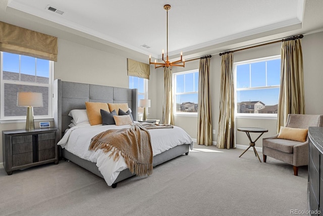 carpeted bedroom featuring ornamental molding, a chandelier, visible vents, and baseboards