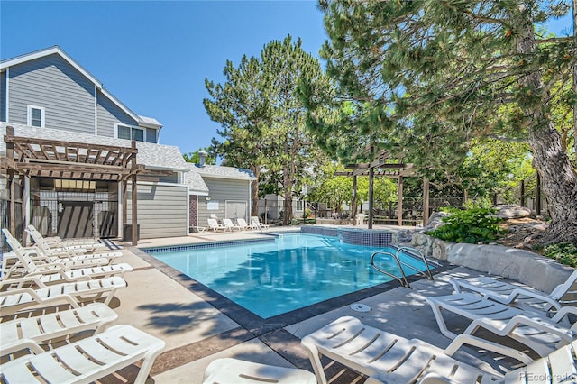 view of swimming pool featuring a patio and a pergola