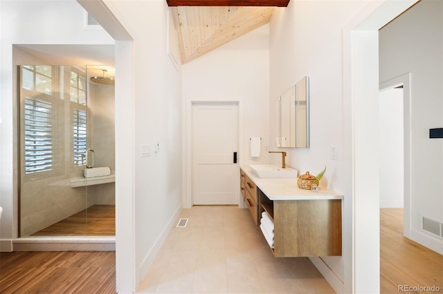 534 W Meadow Rd, Evergreen, CO 80439 - bathroom featuring vanity, a shower stall, high vaulted ceiling, wood finished floors, and wood ceiling