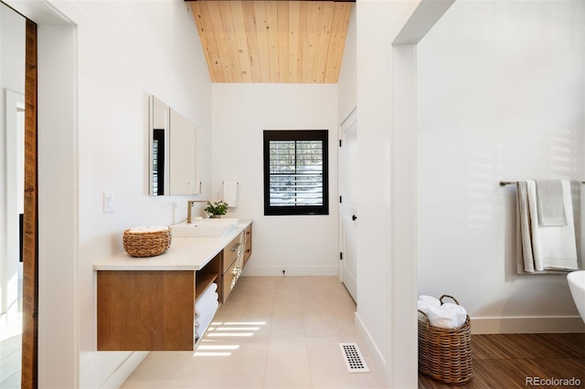 534 W Meadow Rd, Evergreen, CO 80439 - bathroom featuring vanity, wood ceiling, tile patterned floors, and lofted ceiling