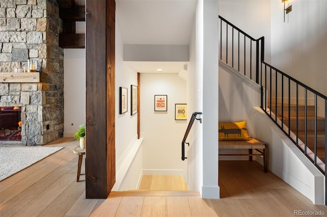 534 W Meadow Rd, Evergreen, CO 80439 - stairs featuring wood finished floors and a fireplace